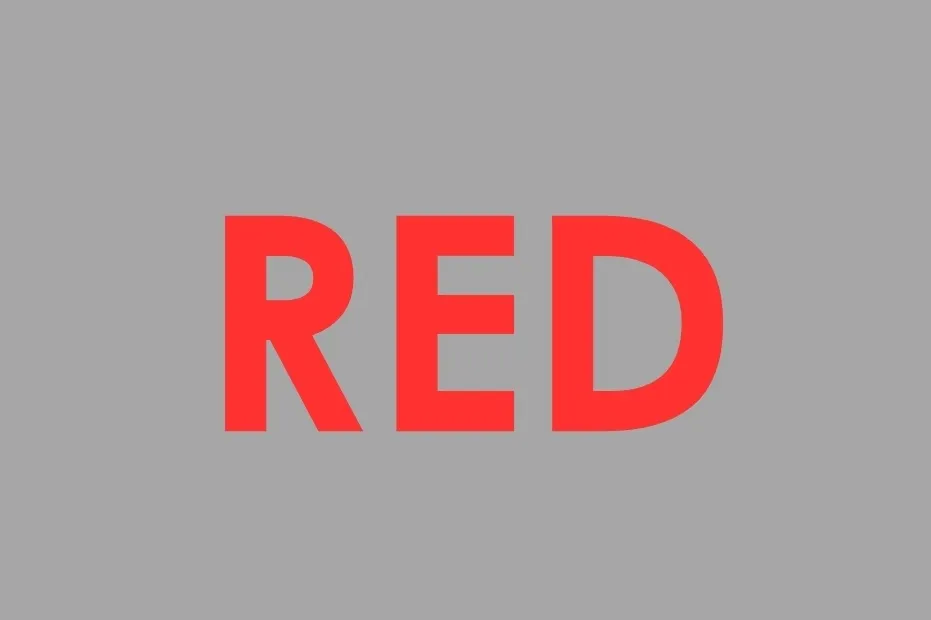 The word RED in bold, red letters against a gray background. It is not orange.