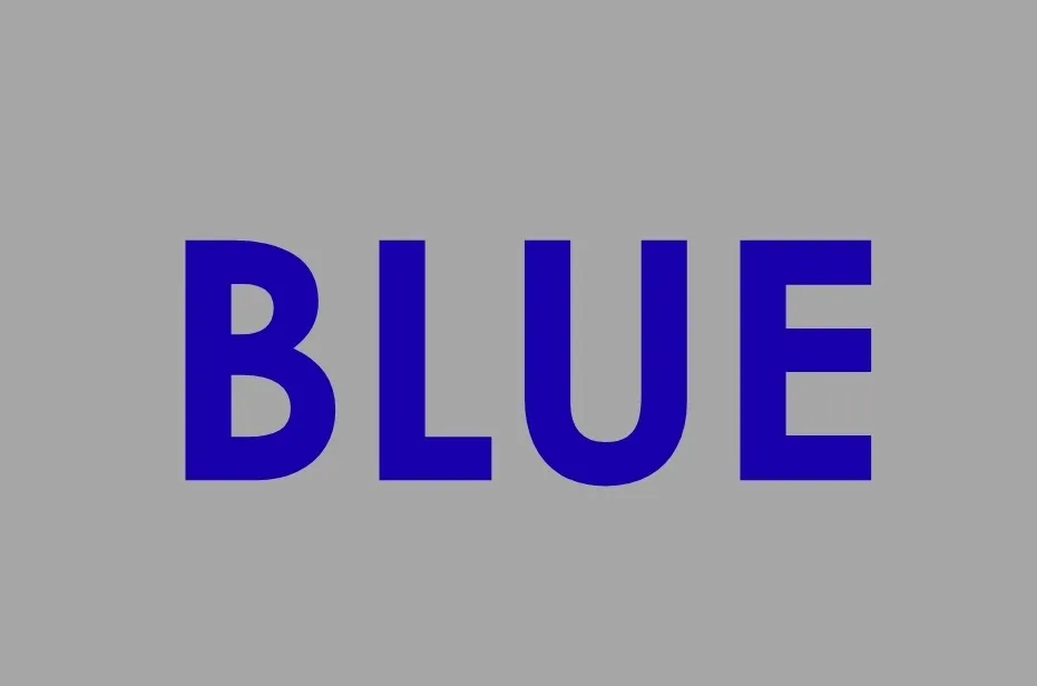 The word BLUE in bold, deep blue letters centered on a plain gray background. Not purple.