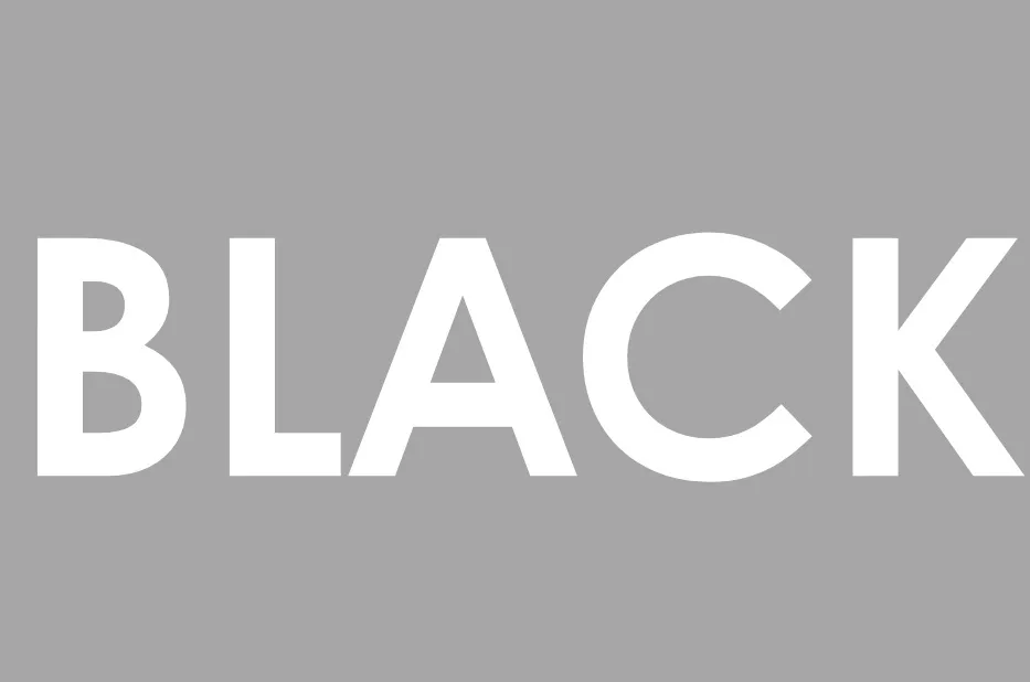 The word BLACK in bold white letters against a solid gray background, illustrating the concept of black.