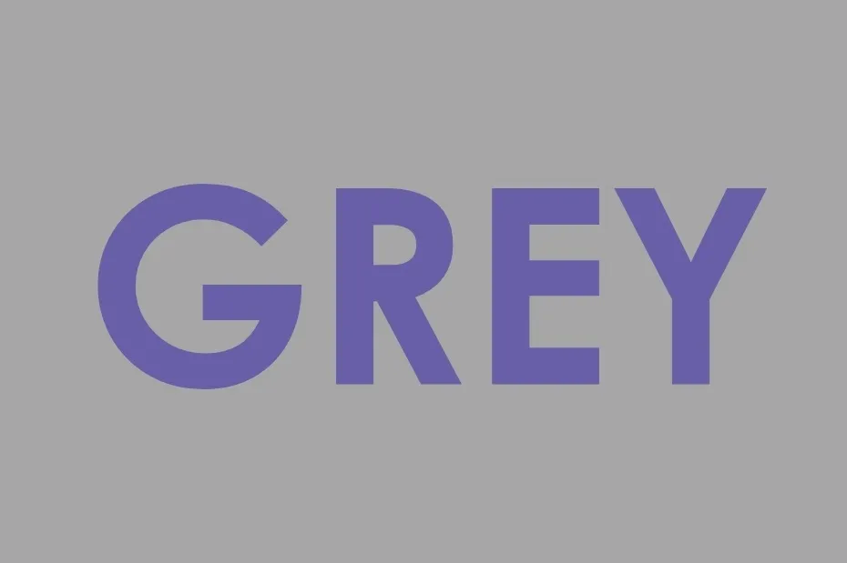The word GREY written in a shade of purple on a gray background, illustrating the color purple.