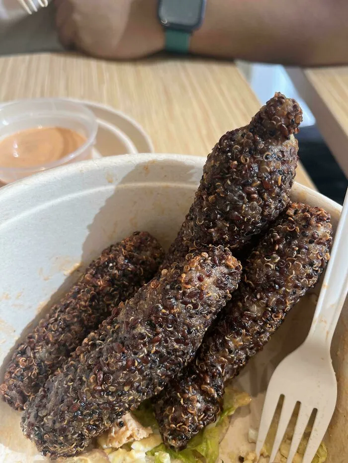 Deep fried quinoa covered food logs in a bowl, a questionable food combo