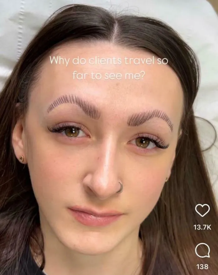 A woman with poorly done microblading at a beauty salon. Her eyebrows look significantly worse after the procedure.