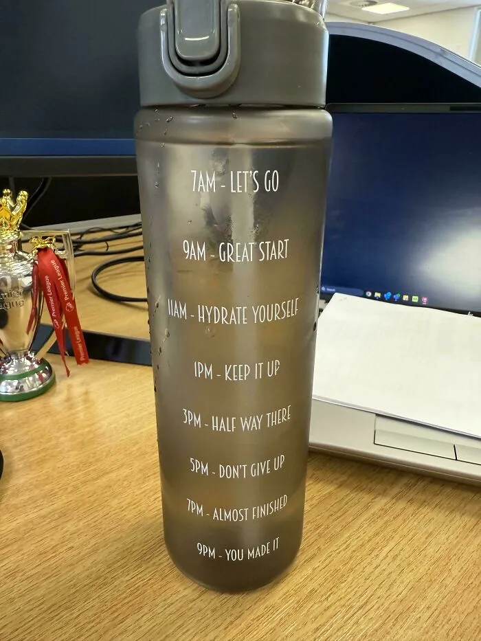 Water bottle with time markers and motivational text illustrating design flaw