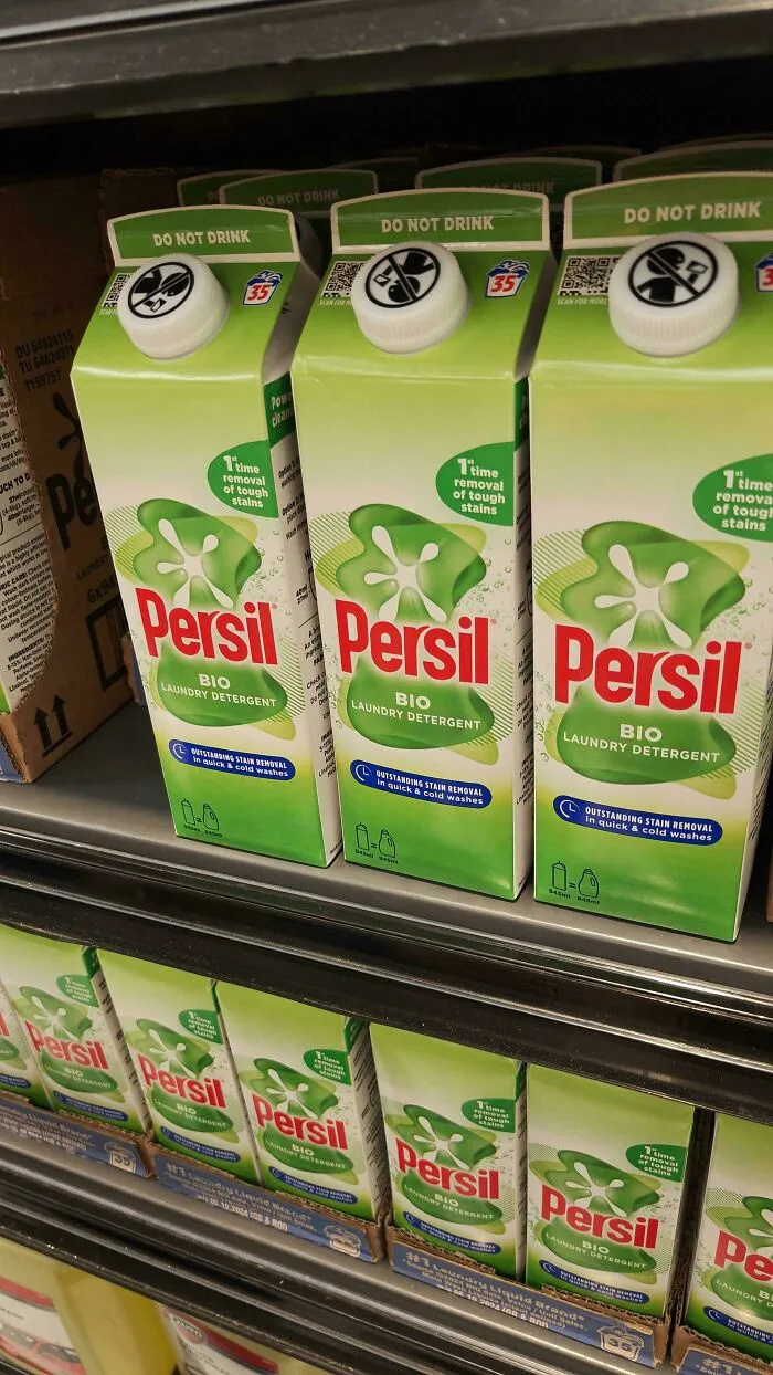 Persil laundry detergent cartons with confusing do not drink labels on cartons at store shelf