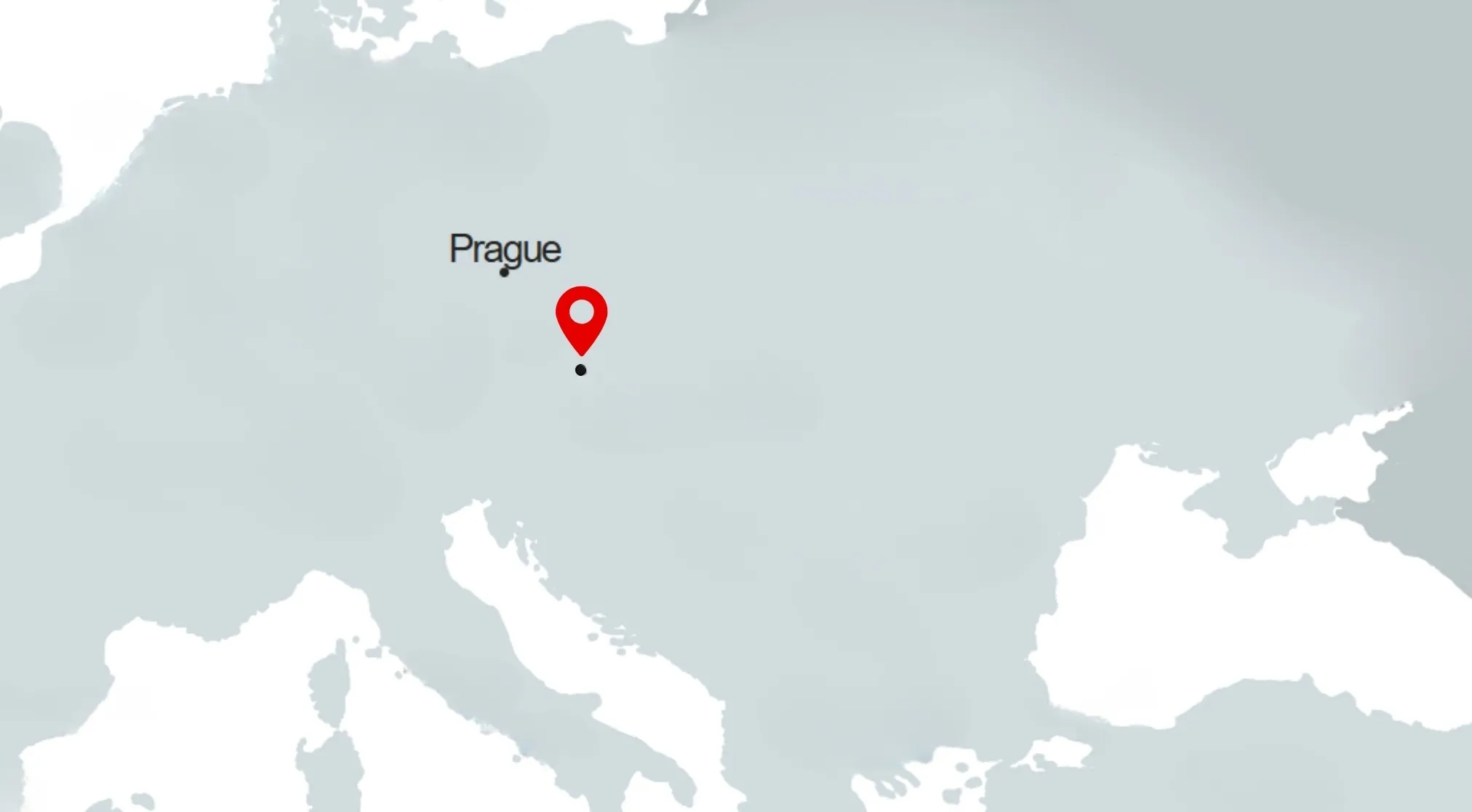 A borderless map showing Europe, with a red pin marking the capital city of Prague. Guess the capital.