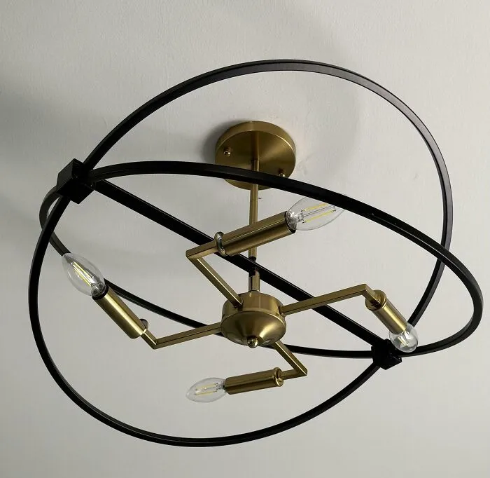 Ceiling light fixture with awkward intersecting rings design fail