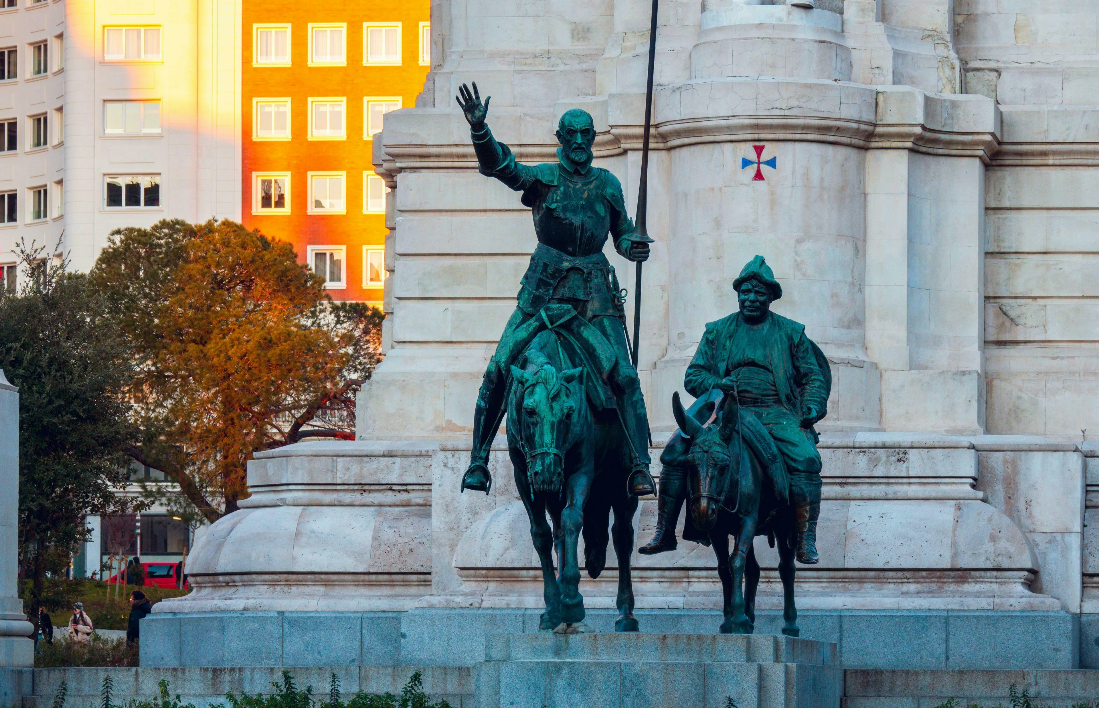Bronze statues of Don Quixote on horseback and Sancho Panza on a donkey, representing world literature.