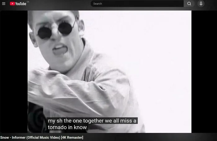 Funny internet moment in a YouTube screenshot of the music video Snow - Informer with nonsensical closed captions.