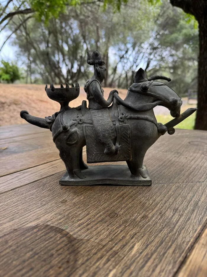 Intricate metallic figure of a rider on a horse, a rare find for antique lovers