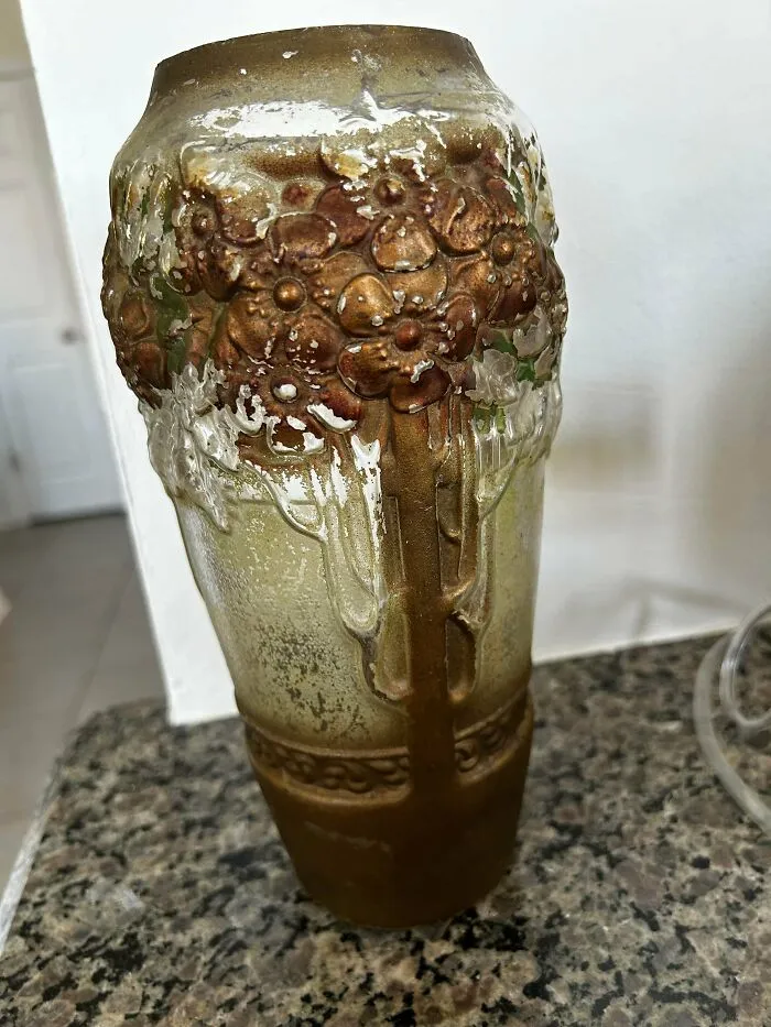 An ornate textured vintage glass vase, a unique find for passionate antique lovers.