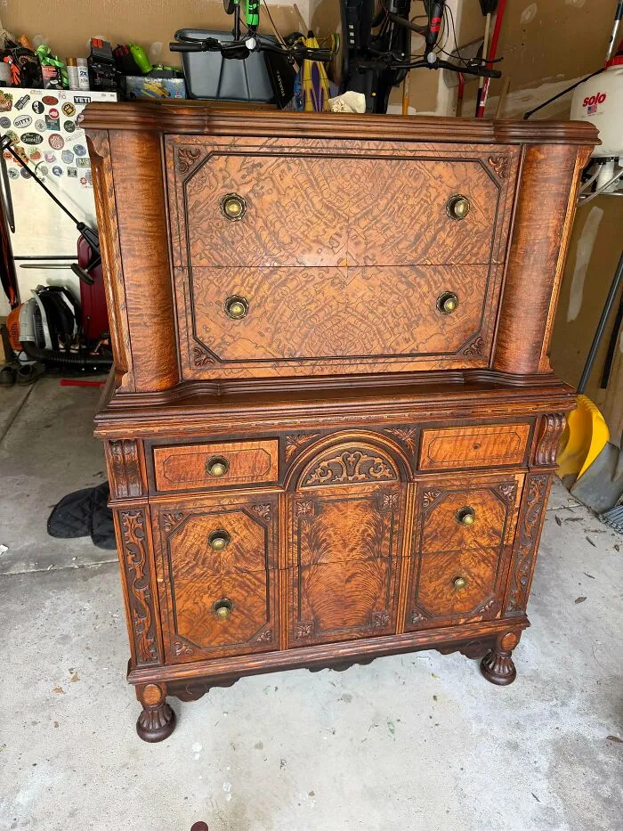 An ornate antique wooden chest of drawers discovered by lucky antique lovers.