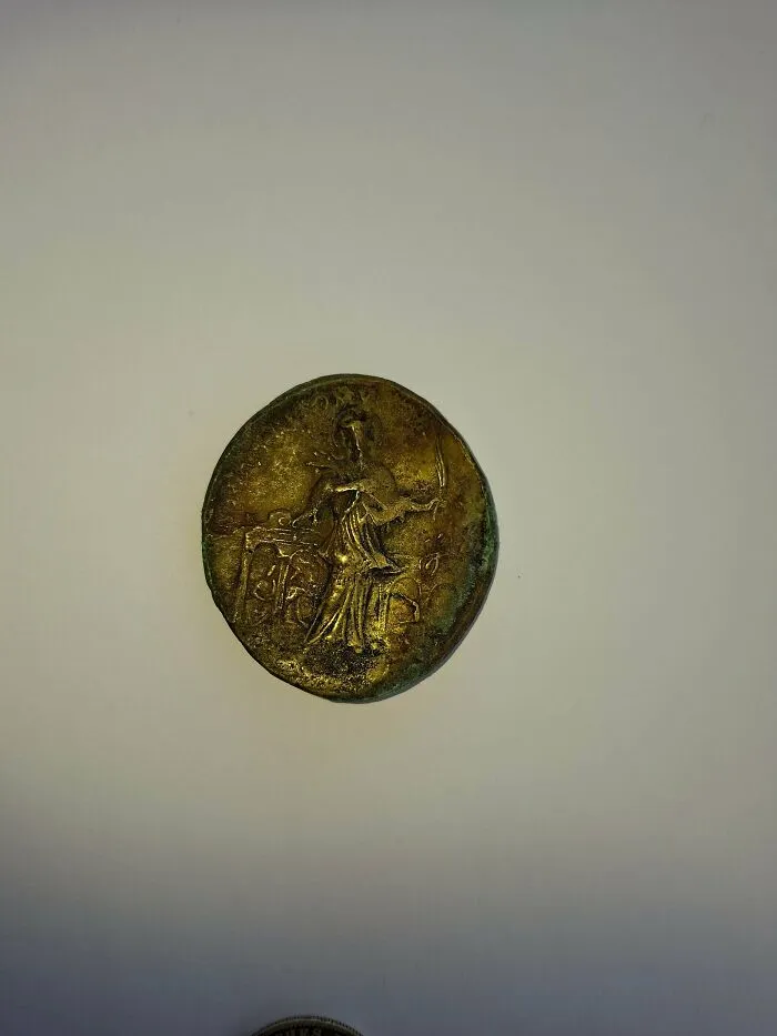 An ancient engraved gold medallion showcase for antique lovers to appreciate.