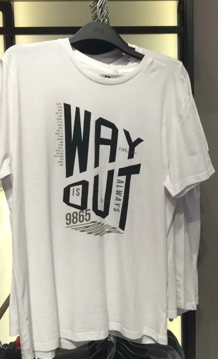 A white t-shirt with abstract black text that reads 'WAY IS OUT ALWAYS' with numbers, a questionable clothing design.