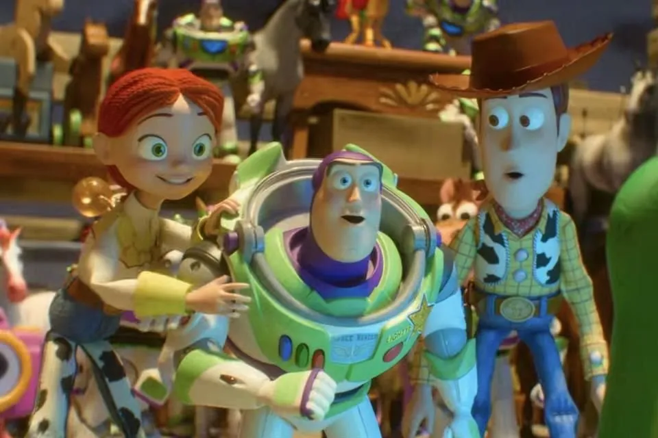 Jessie, Buzz Lightyear, and Woody from Toy Story animated movie look surprised in a close-up shot of the characters.