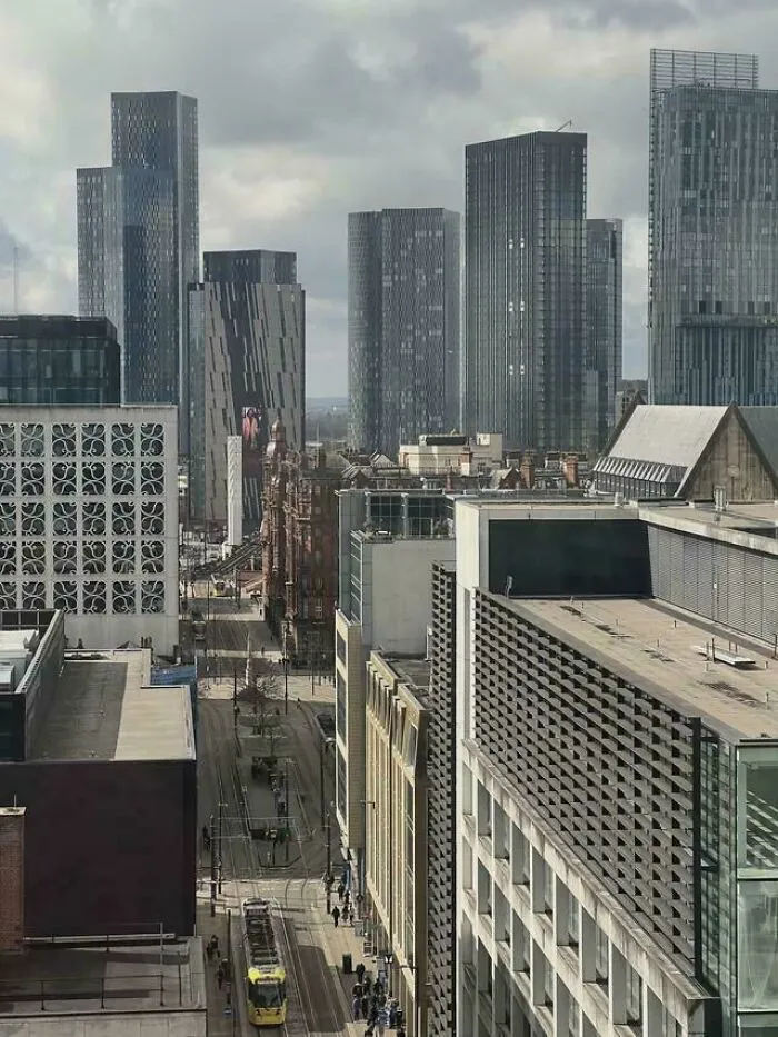 Modern city skyline with high-rise buildings and tram street in urban area