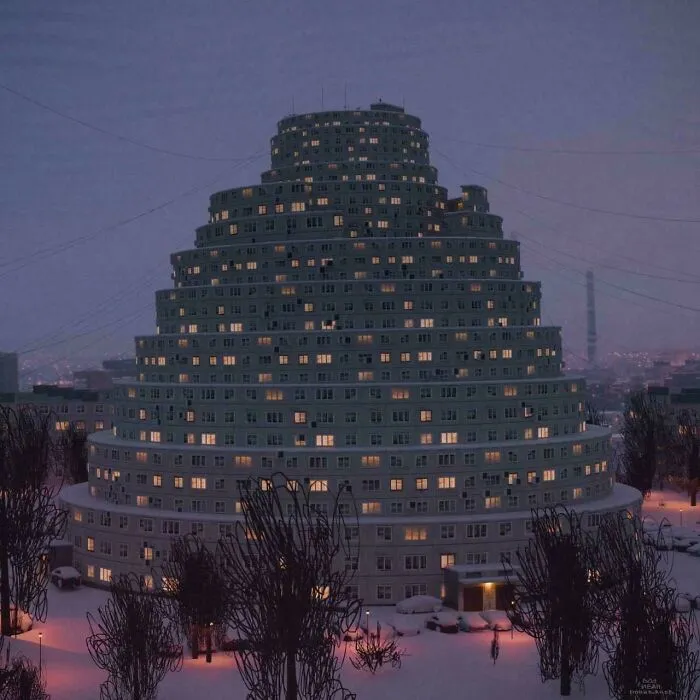 Nighttime view of a pyramid-shaped apartment building with many lights on