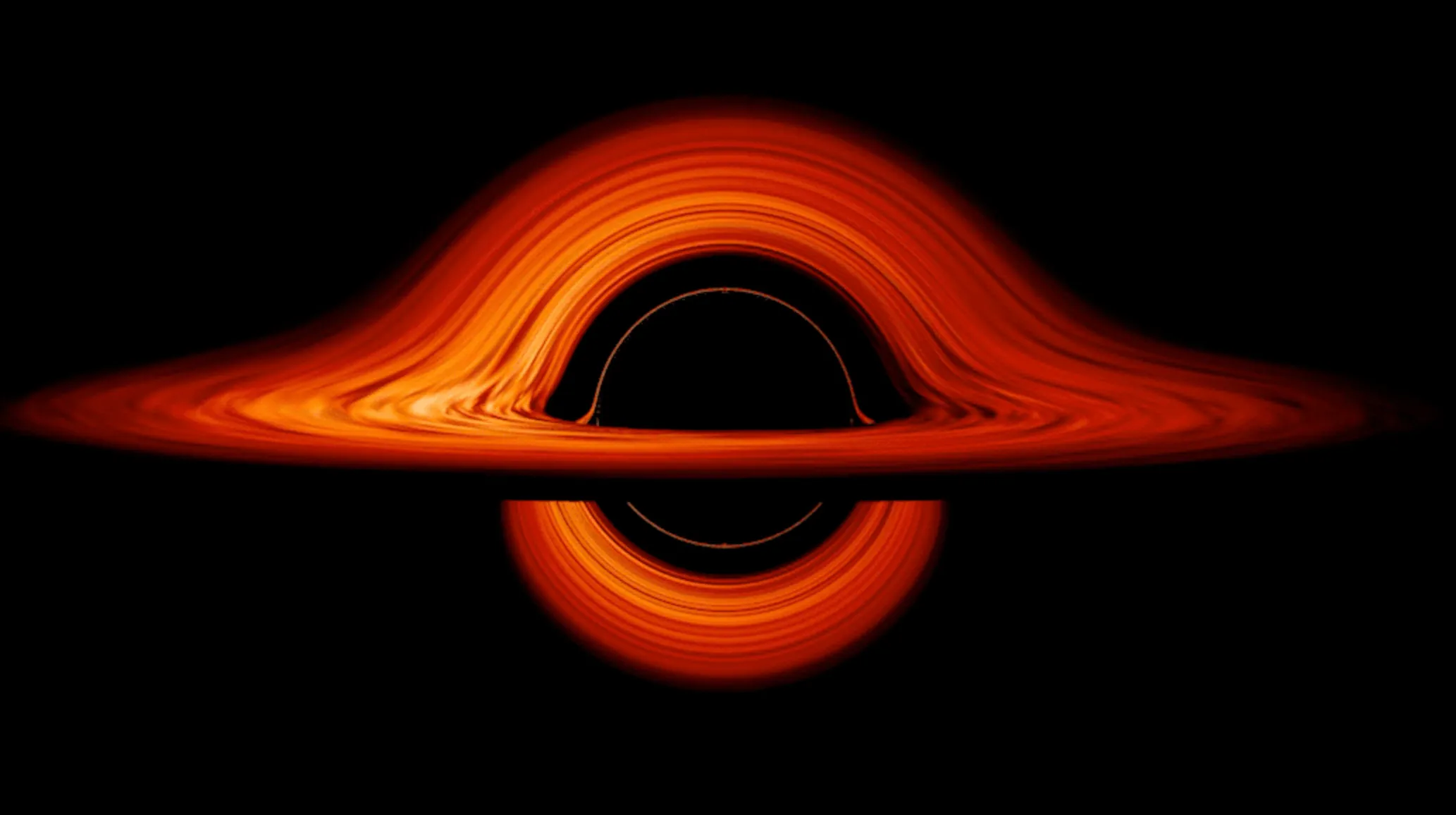 A vibrant orange and red accretion disk swirling around a black hole, illustrating a science general knowledge quiz question.