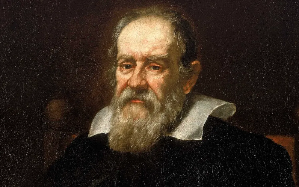 A detailed oil painting of Galileo Galilei, a scientist with a long white beard and a white collar, against a dark background.