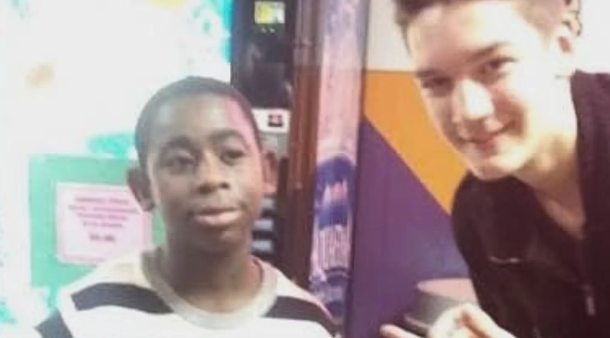 Two young boys, one in a striped shirt, the other smiling in black, sparking celebrity doppelgangers discussion.