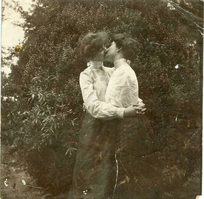 Unknown 2 Women Behind Bushes Share A Kiss, Circa 1900s