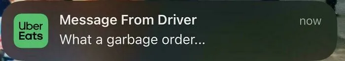 Uber Eats message from driver calling a food delivery order garbage, highlighting a food delivery fail.