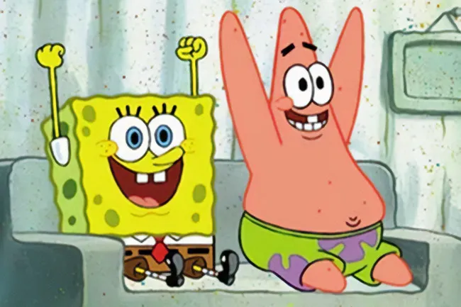 SpongeBob & Patrick, the iconic duo, sitting on a couch, smiling and raising their hands in excitement.