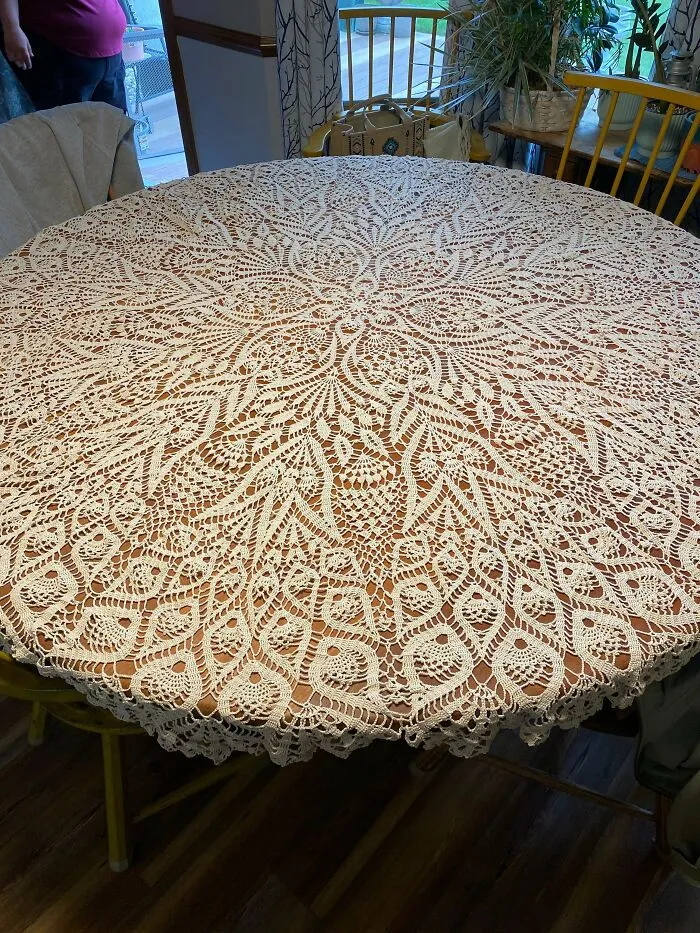 Intricate crocheted tablecloth with detailed lace pattern