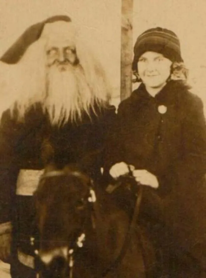 A Girl On A Horse Beside Santa Claus