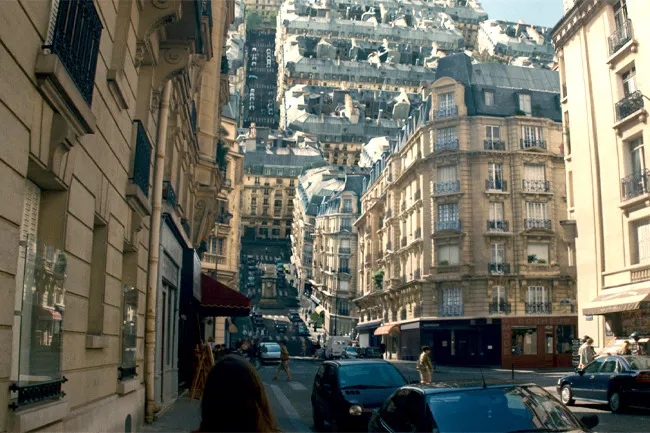 A cityscape bending and folding upon itself, a visual from the movie Inception perfect for a movie night alone.