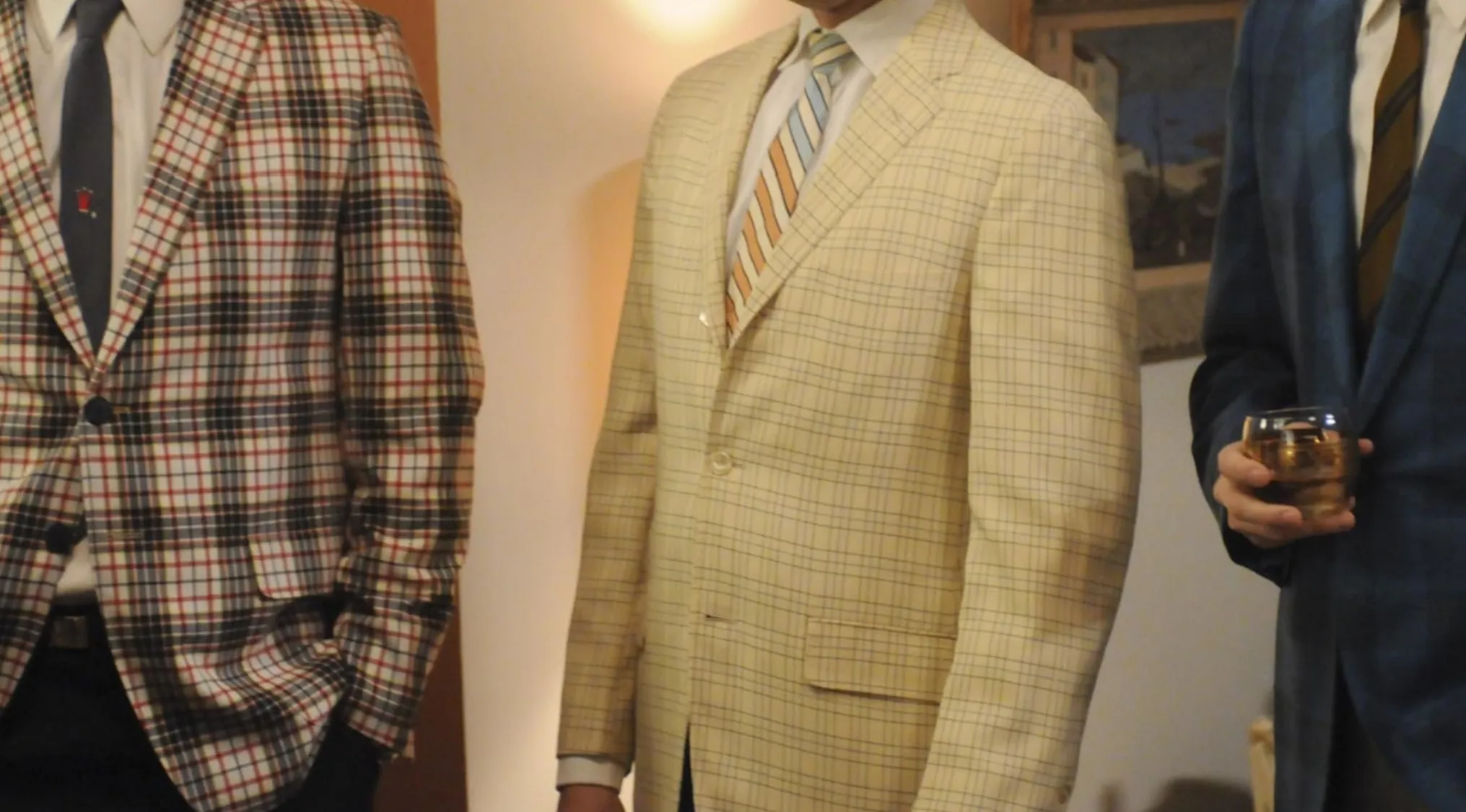 Classy TV show outfits featuring three men in sophisticated plaid and striped blazers, perfect for timeless style inspiration.