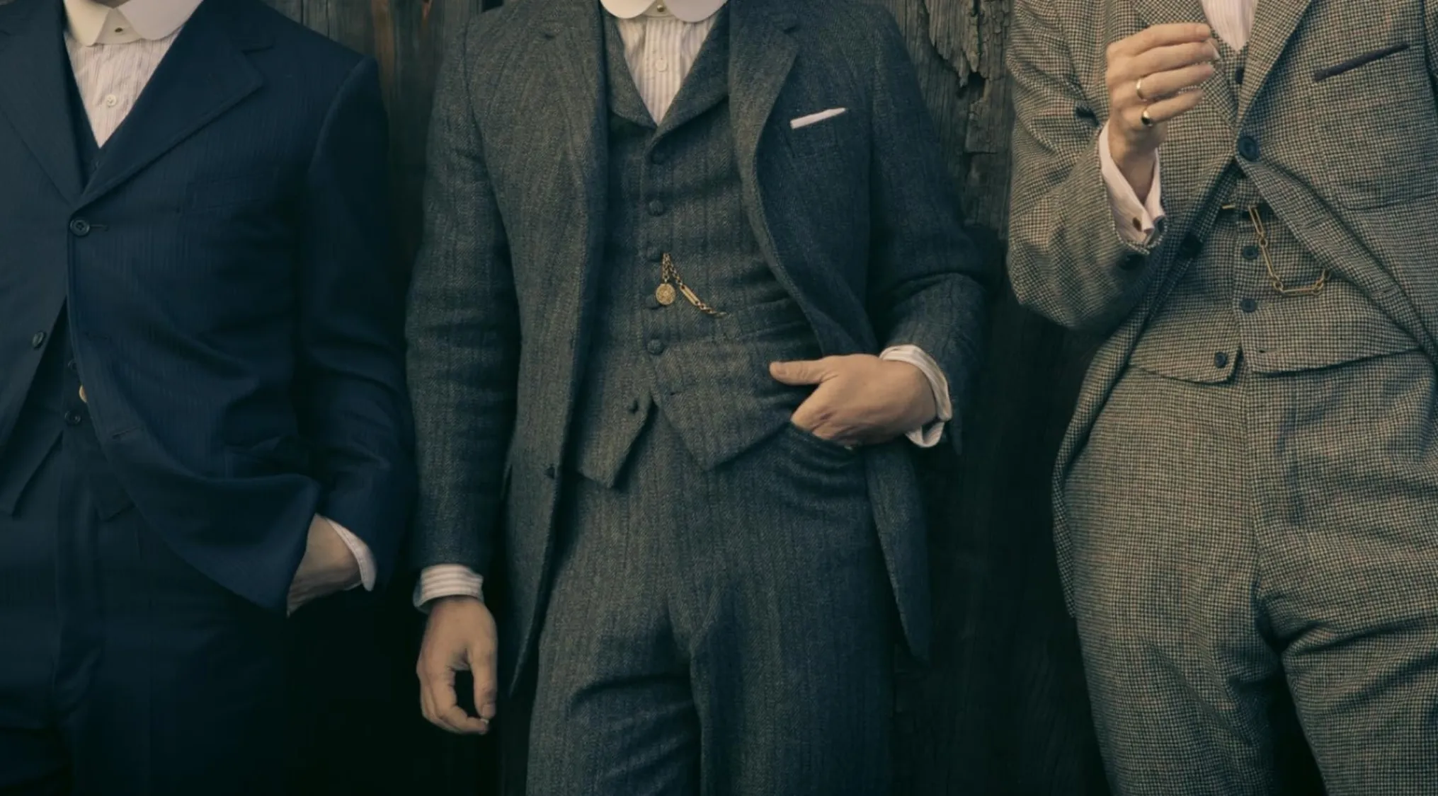 Three men in vintage suits, showcasing classic TV show outfits and period fashion.