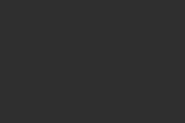 A solid, dark gray color, illustrating a choice of color for various design or personal preferences.
