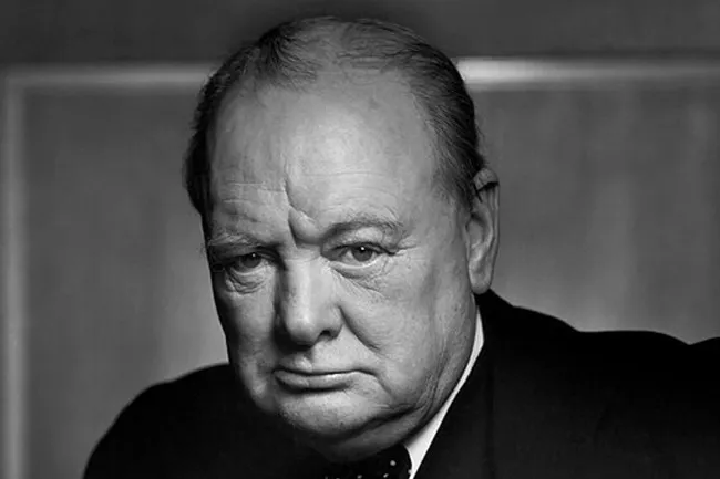 Black and white portrait of Winston Churchill, looking serious. A historical figure in a crisis.