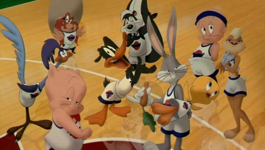 General Knowledge quiz: The Tune Squad, including Bugs Bunny, Daffy Duck, and Lola Bunny, standing on a basketball court in Space Jam.