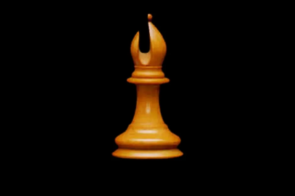 A light colored chess piece, the bishop, is centered against a black background. This piece can move only diagonally.