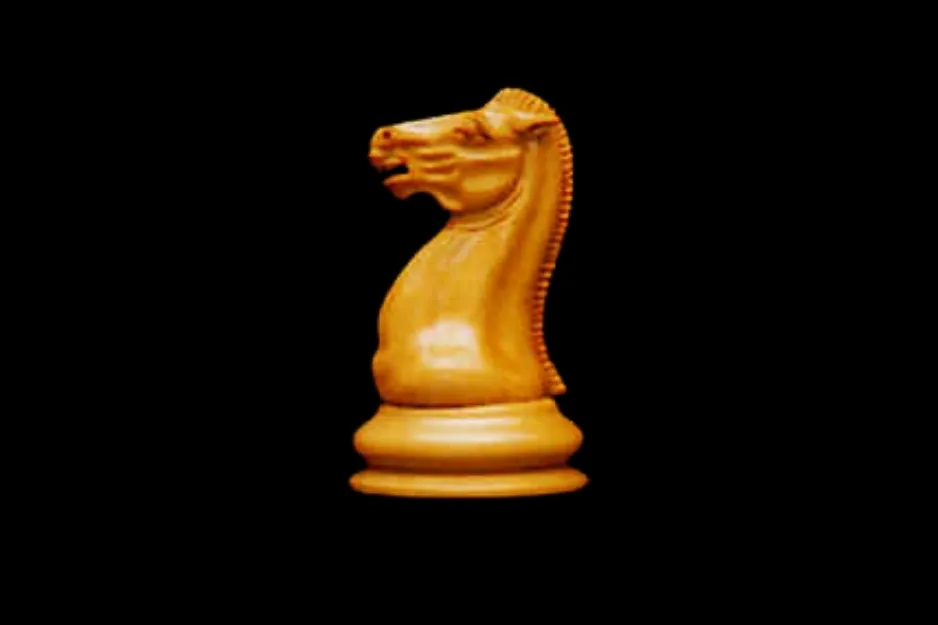 A light wooden chess piece (Knight) on a dark background. This chess piece moves in an L-shape, not diagonally.