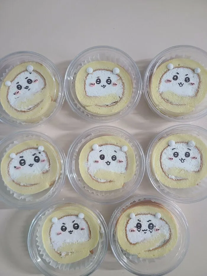 Eight individual swiss roll treats with cute hamster faces, perfect examples of amazing and delicious baking.