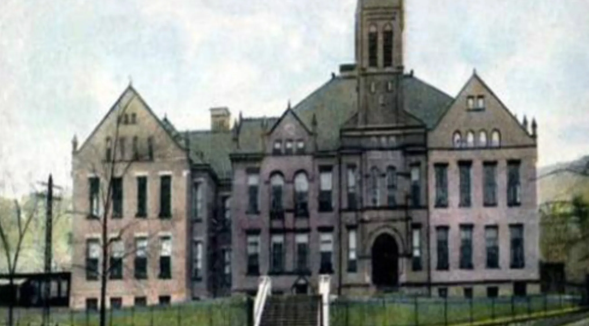 Historical image of a large school building, similar to the one attended by Holden Caulfield in The Catcher in the Rye.