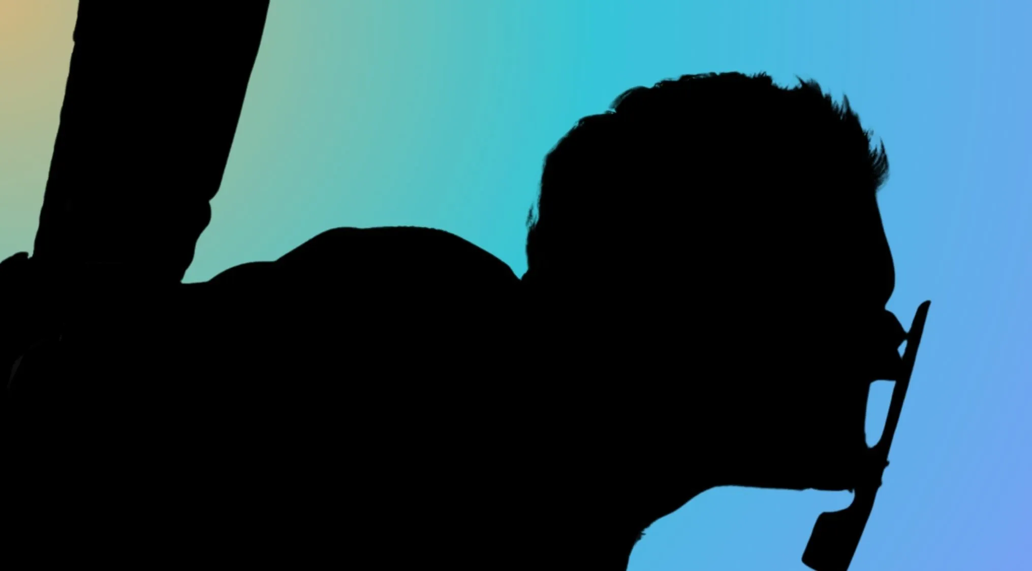 Silhouette of a character from the Mad Max franchise with a distinctive mask.