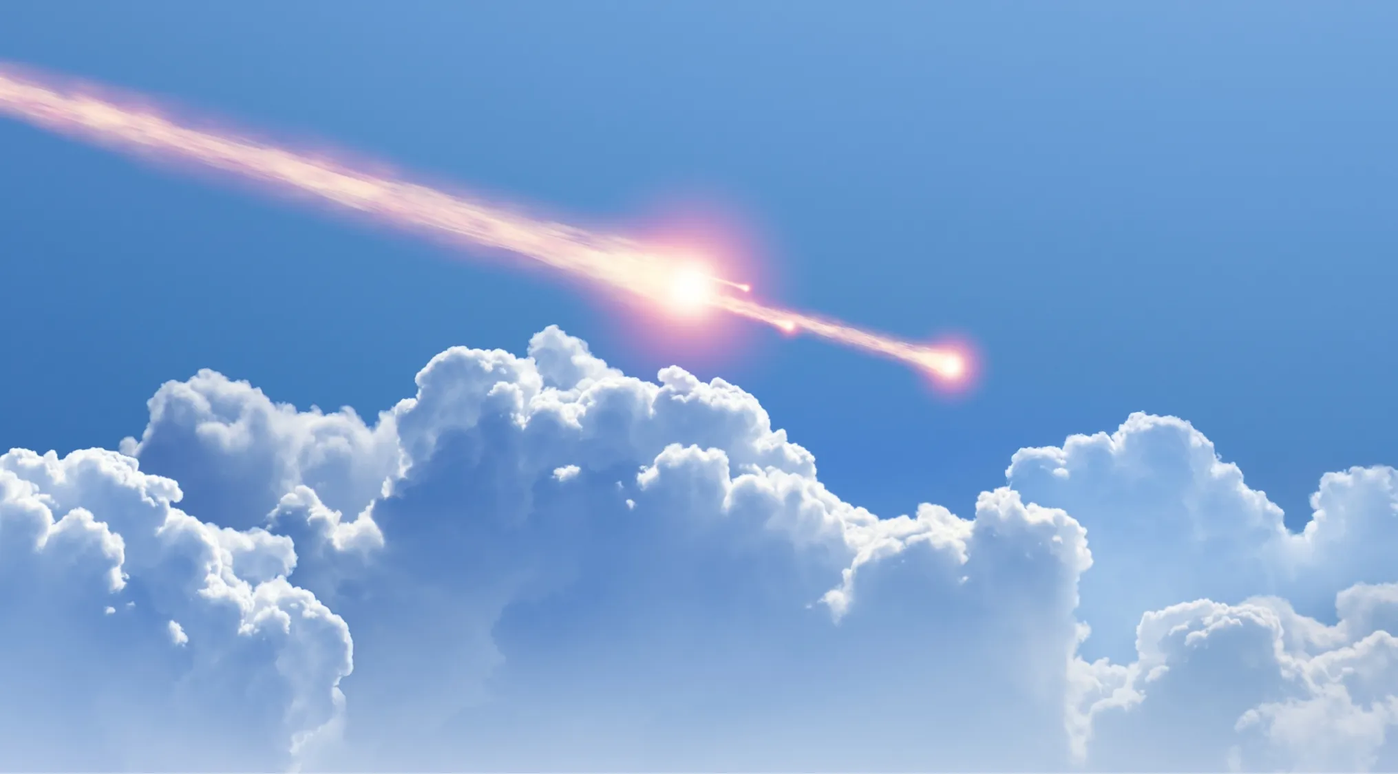 Bright meteor streaks across a blue sky above fluffy white clouds. Most meteors burn up in Earth's atmosphere.