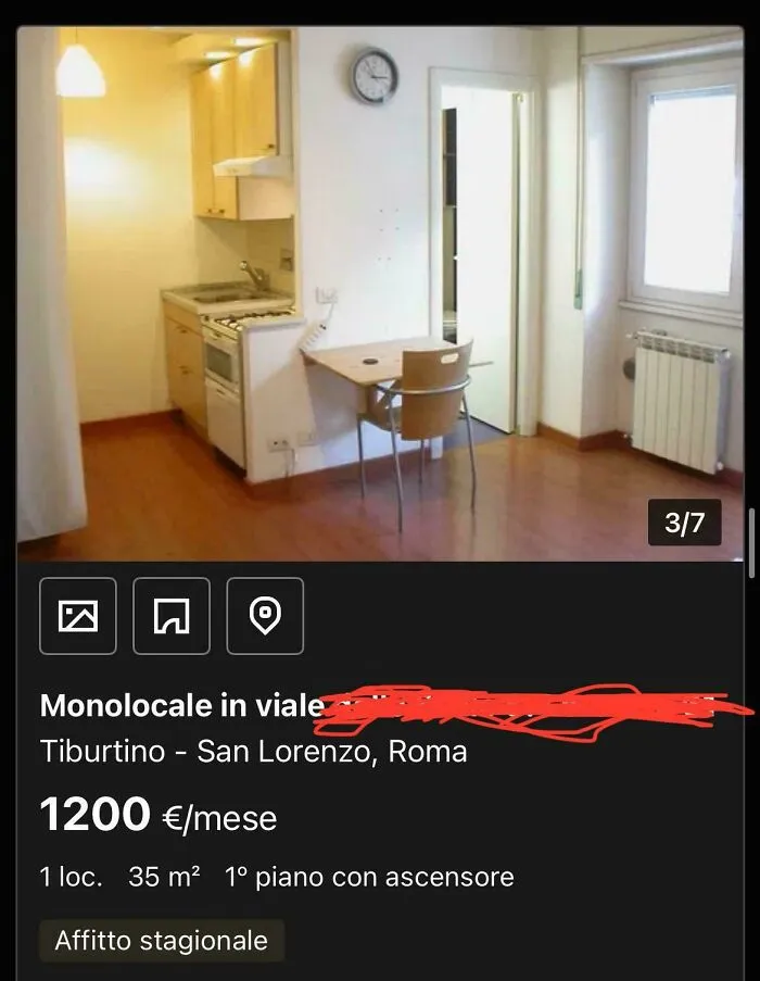 A tiny studio apartment with a compact kitchen and small dining table, an unhinged real estate listing.