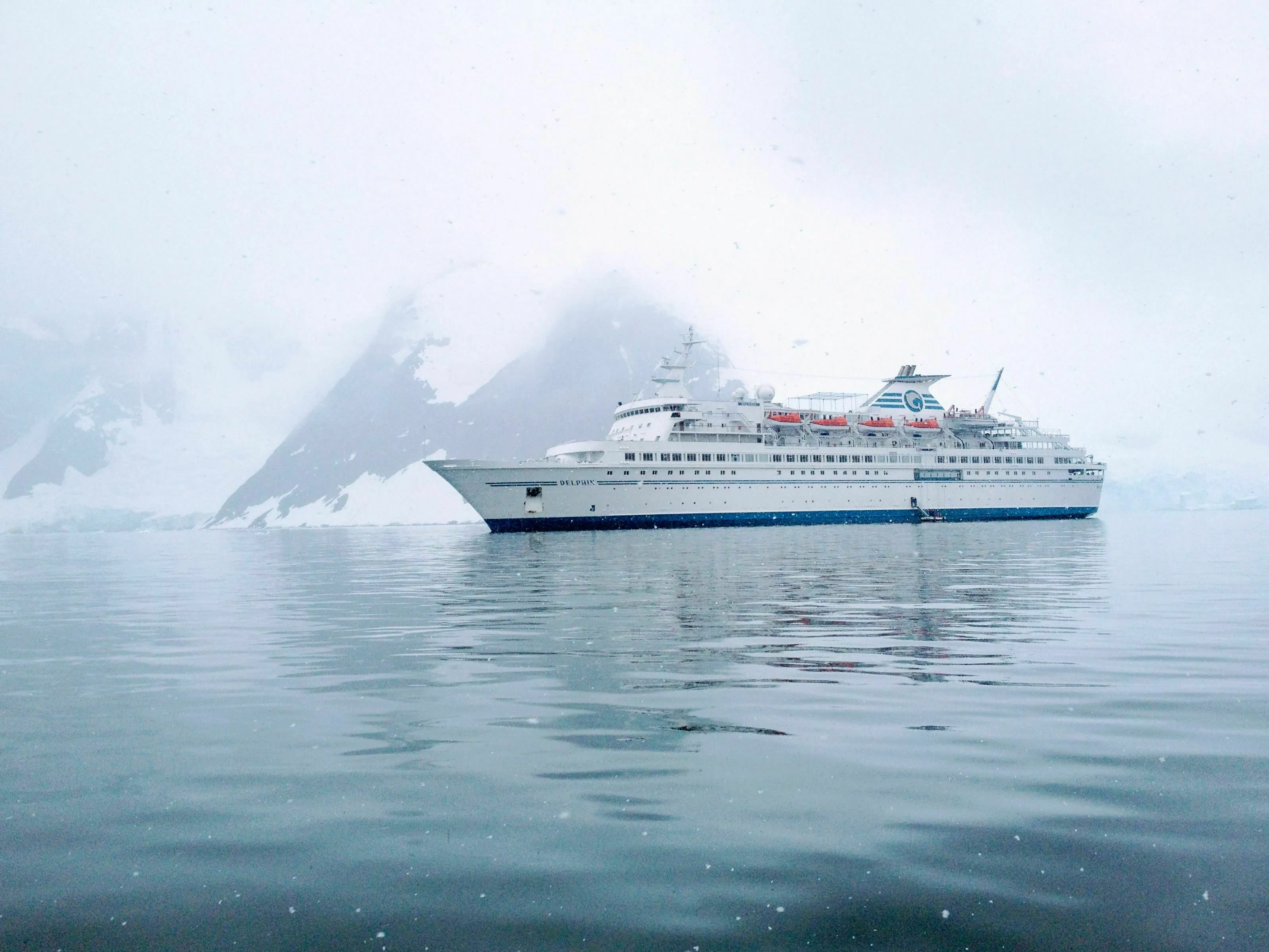 A general knowledge quiz image of a large ship sailing through icy waters with an iceberg in the background.