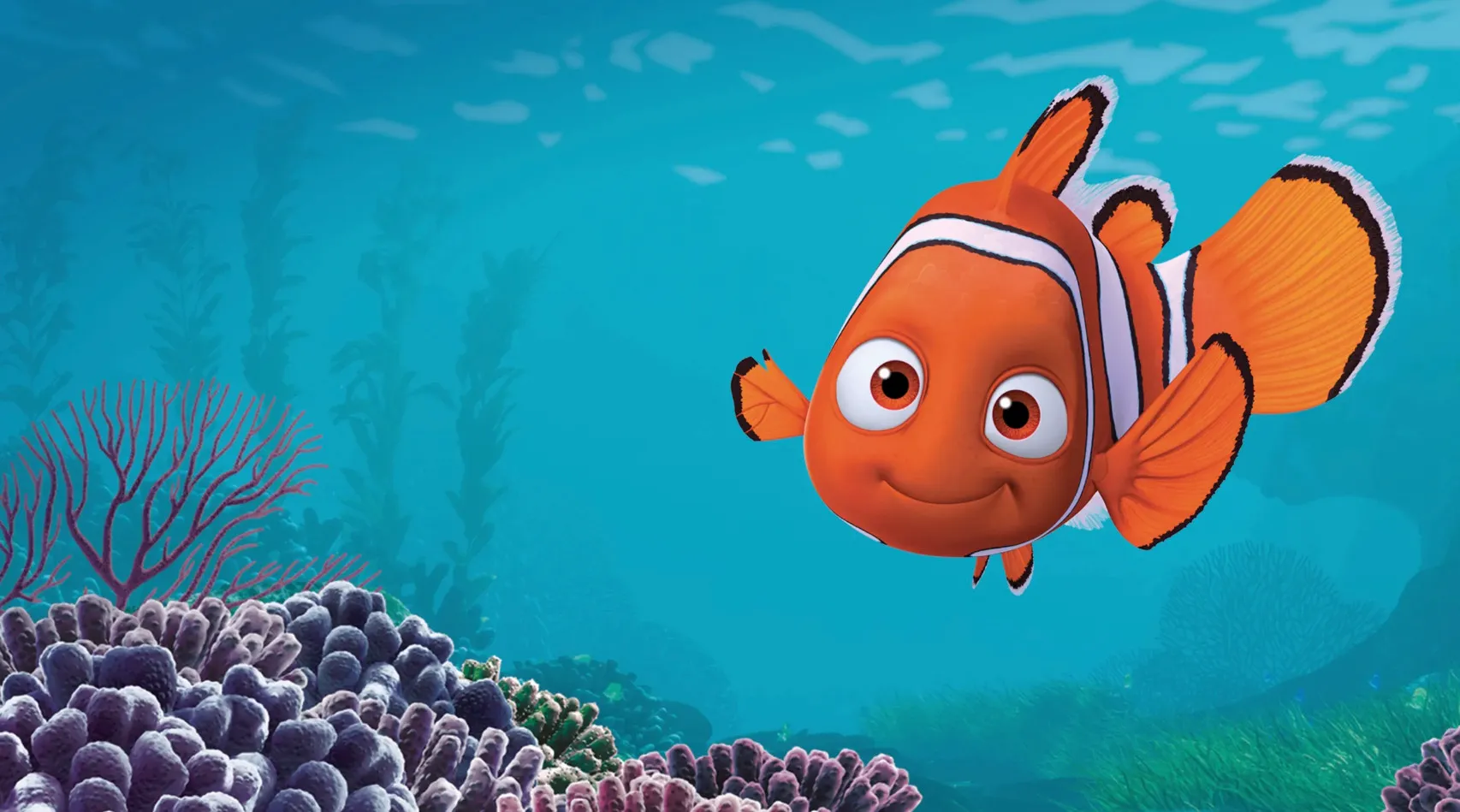 Smiling clownfish, Nemo, underwater among corals, part of a General Knowledge Quiz about the type of fish Nemo is.