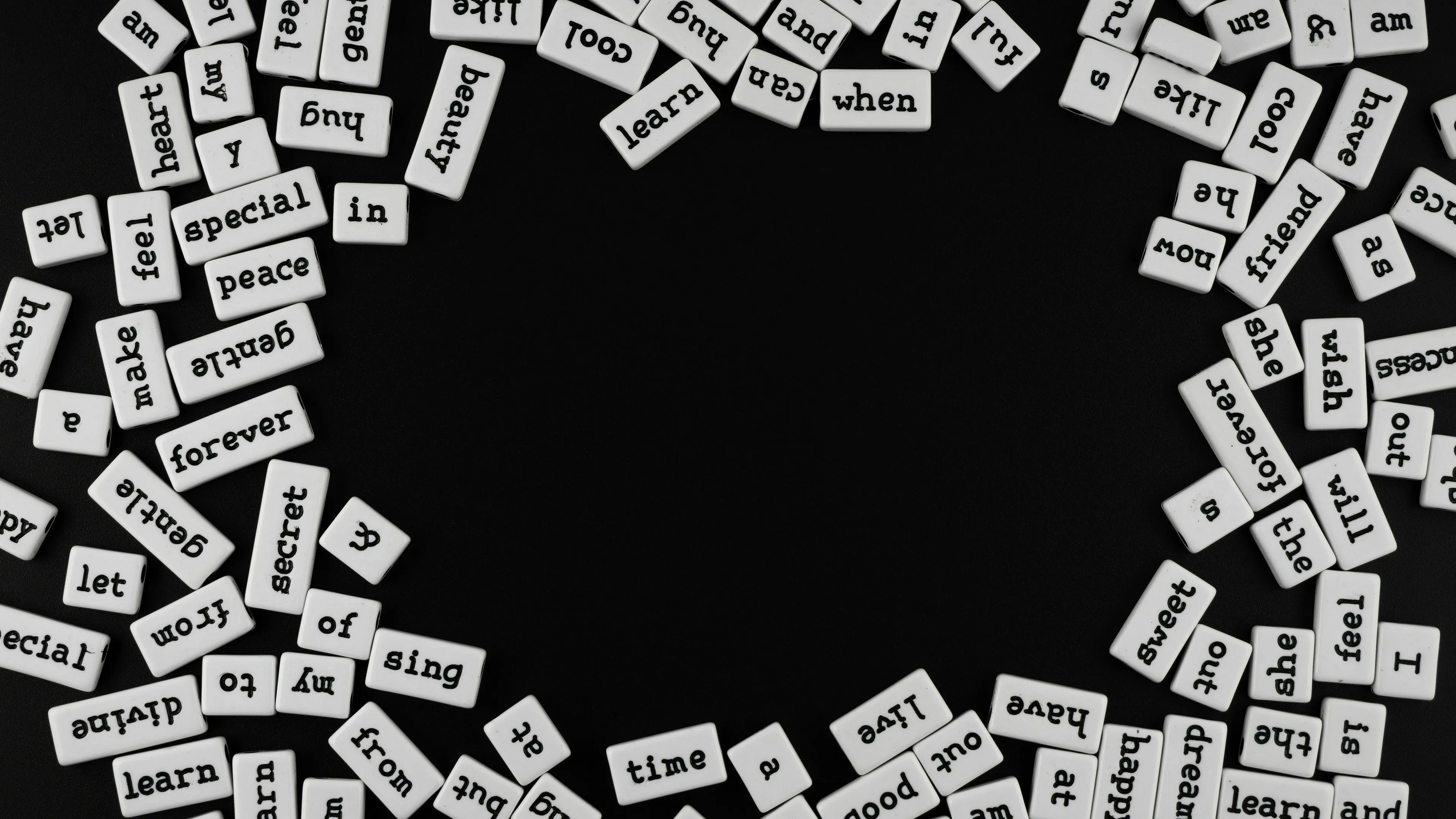 A general knowledge quiz image showing numerous word tiles scattered around a black background, with an empty center.