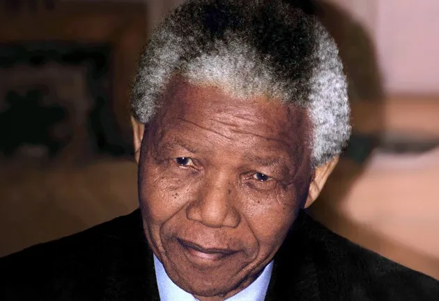 Nelson Mandela smiling, a prominent historical figure and anti-apartheid revolutionary.