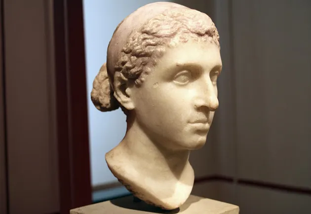 A marble bust of Cleopatra, a historical figure from ancient Egypt.