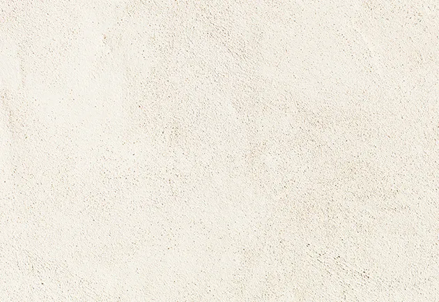 Close-up of a light, rough ivory material texture, suitable for a material choice.