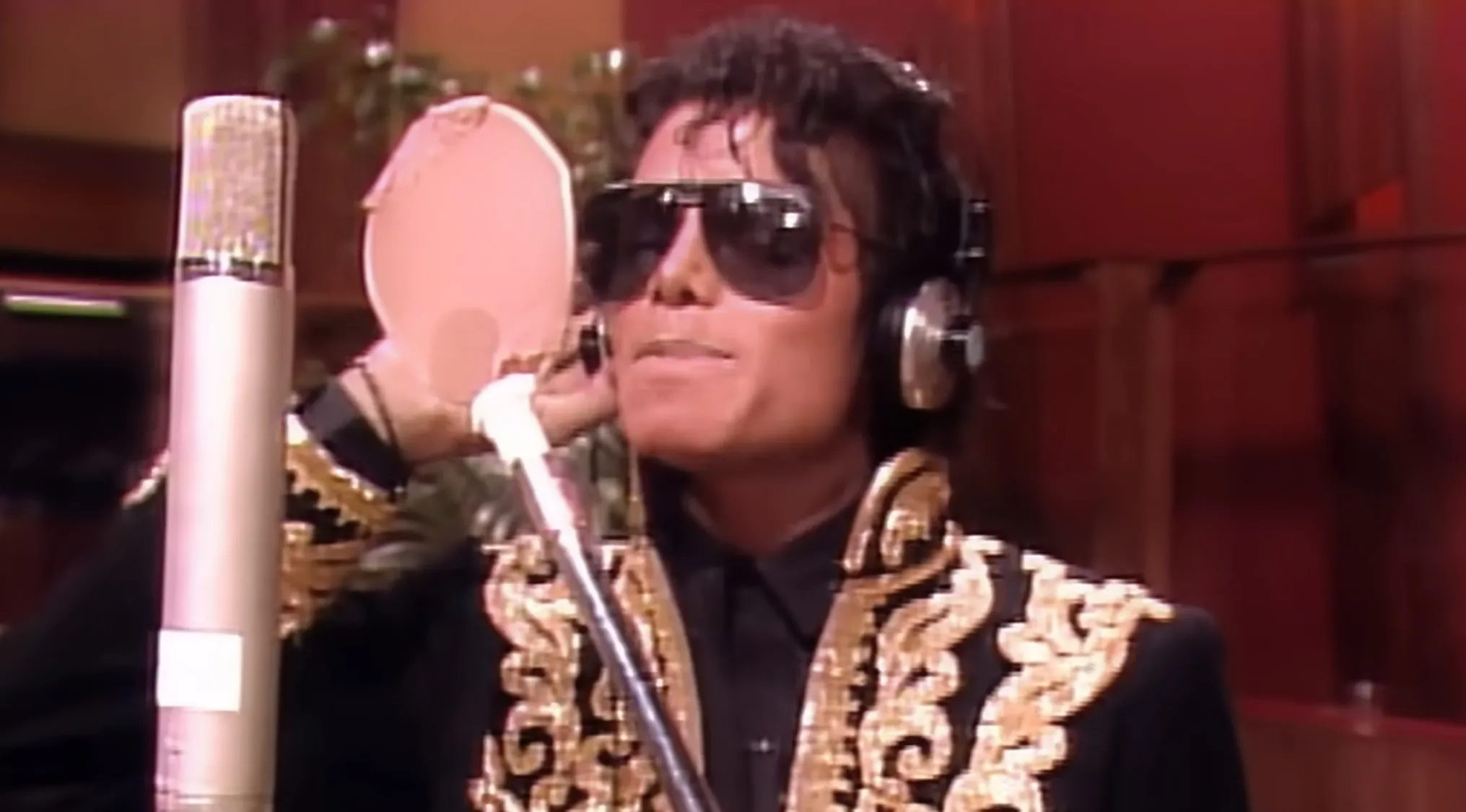 Michael Jackson, co-writer of We Are the World, recording the charity single for African famine relief.