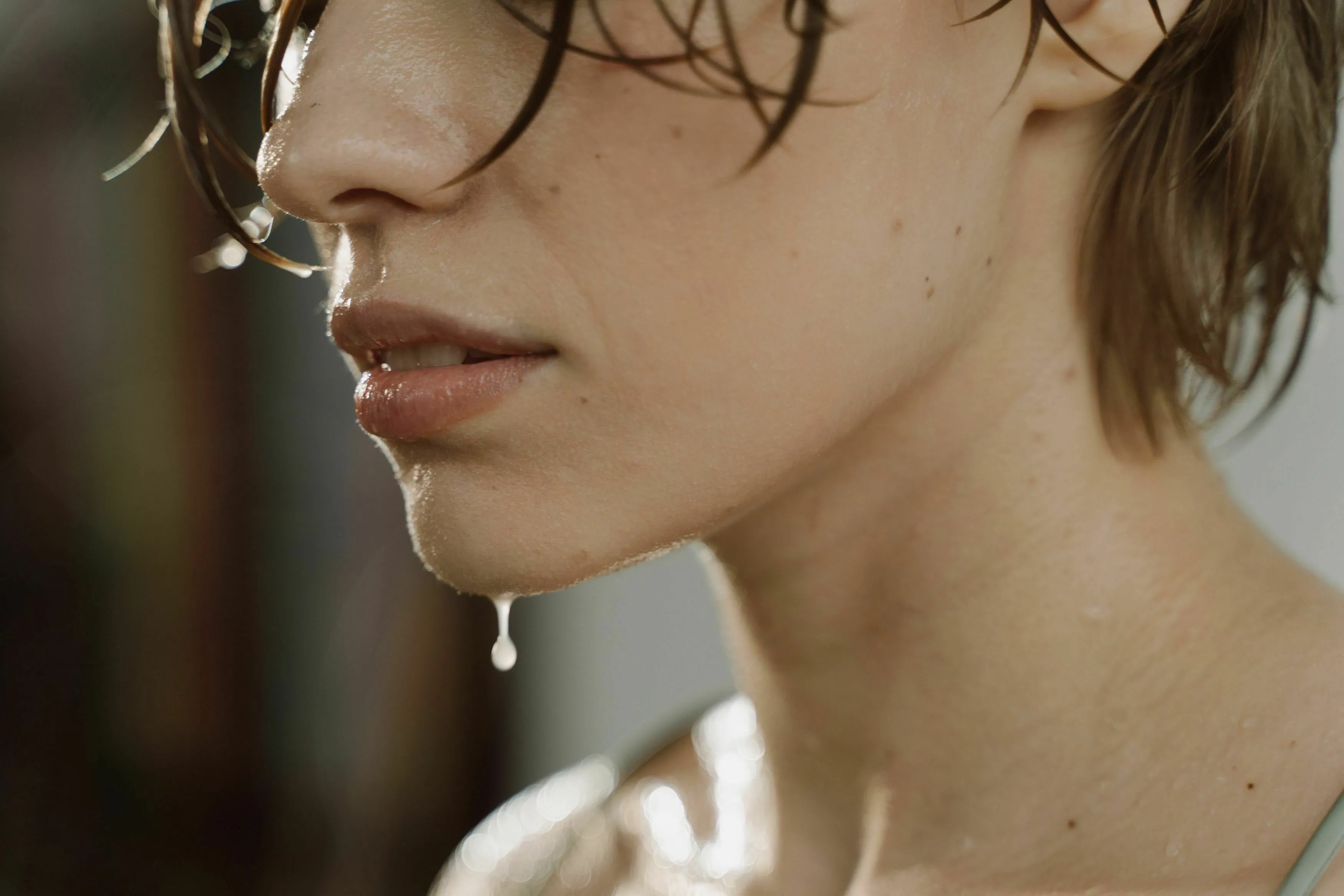 Basic medical knowledge quiz image showing a person with saliva, related to the enzyme found in human saliva.