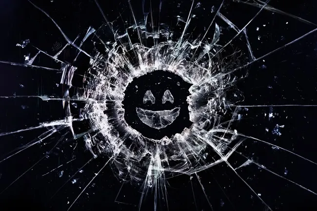 A Black Mirror logo with a shattered screen effect, featuring a smiling face in the center of the cracks.